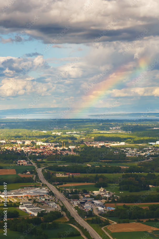 Landscape with a rainbow of mountains, village houses. A view of the earth from the sky. Shooting with copter. France