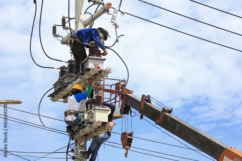 Technicians Working on Electrical Pole Technicians Working on Electrical Pole