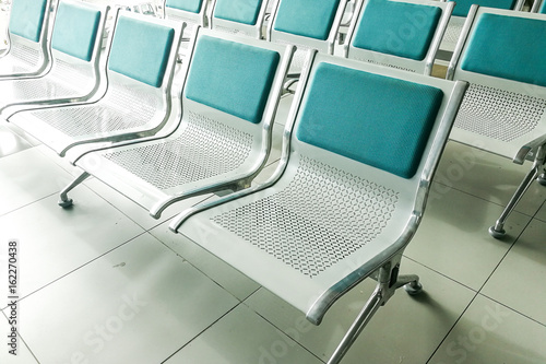 Rows of empty chairs at waiting area