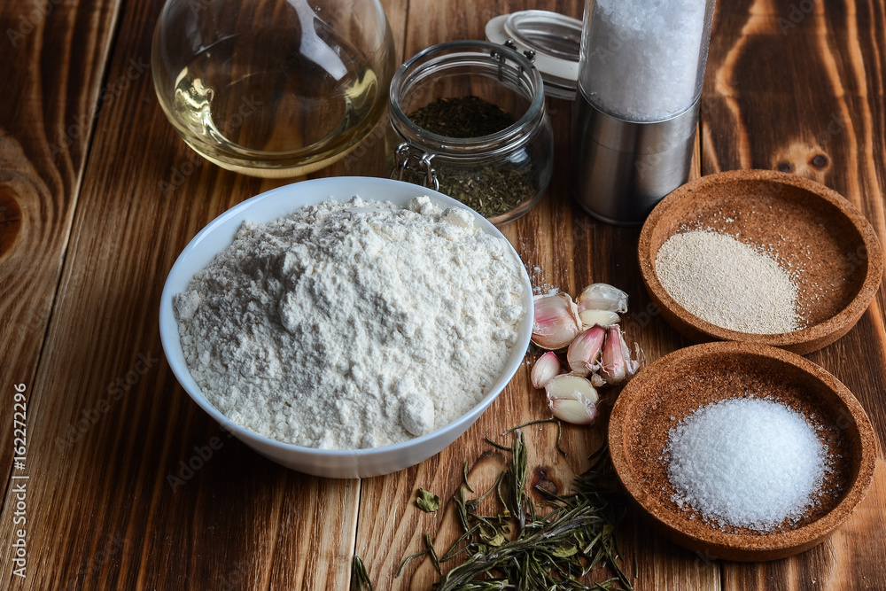 Flour, garlic and spices, a set of ingredients Flour, garlic and spices, a set of ingredients