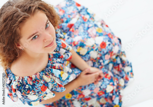 Fényképezés portrait of cute young girl in frilly summer dress