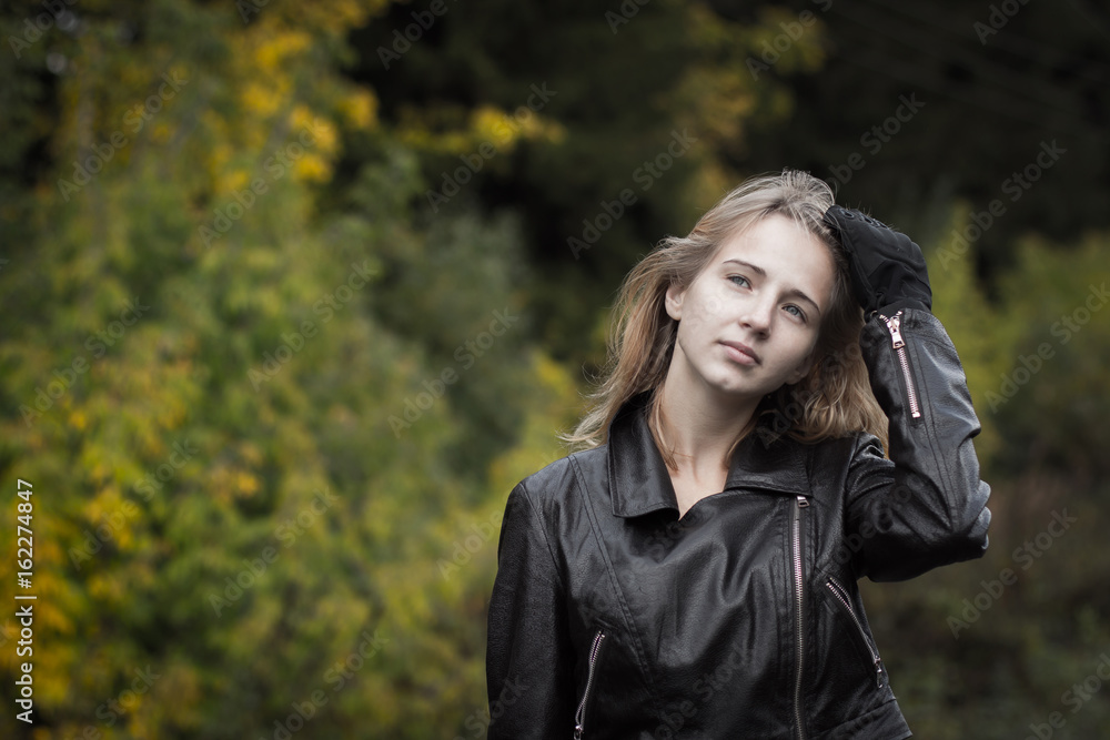 Nice girl outdoor in an autumn day