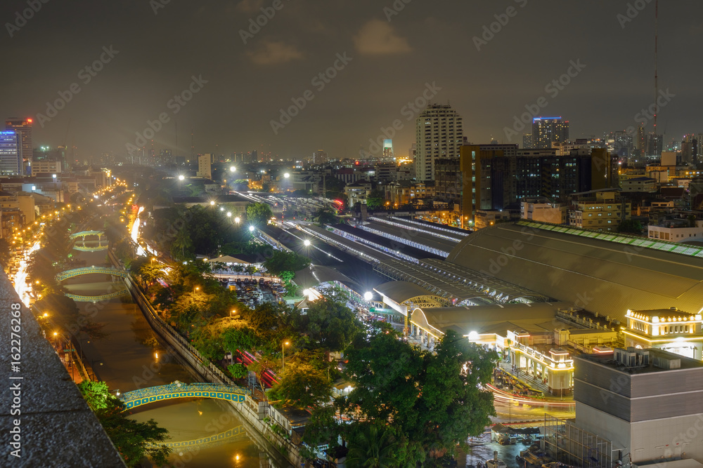 Transportation system / View of transportation system and city at night. Bangkok train station (HUA LUMPONG).