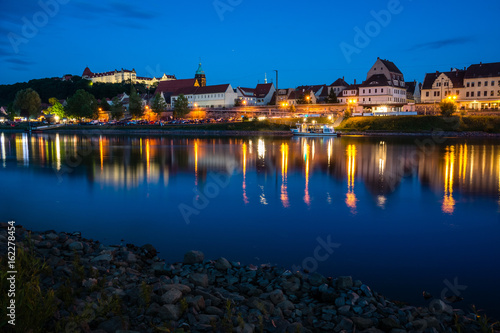 Night view of the Pirna city over the Elbe river in Saxon Switzerland, Germany