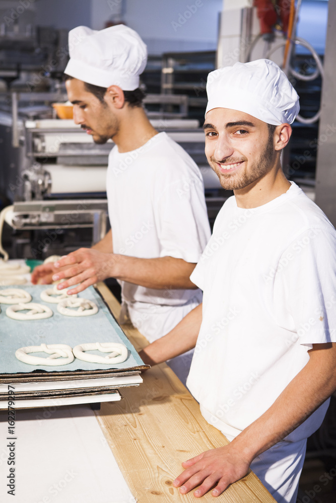 Preparing pretzel dough in bakery Preparing pretzel dough in bakery