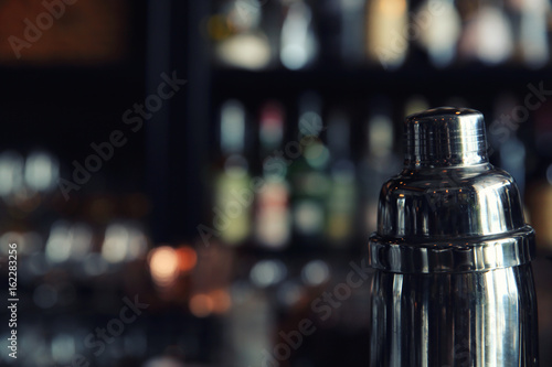 cocktail shaker on counter bar background