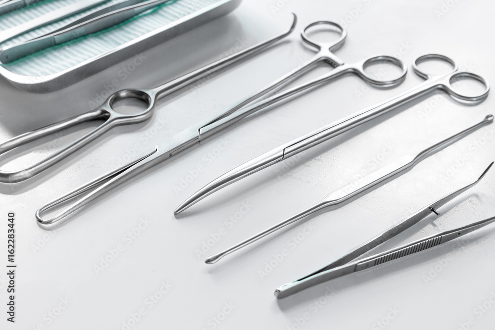 Medical instruments for cosmetic surgery on white table backgrond Medical instruments for cosmetic surgery on white table backgrond