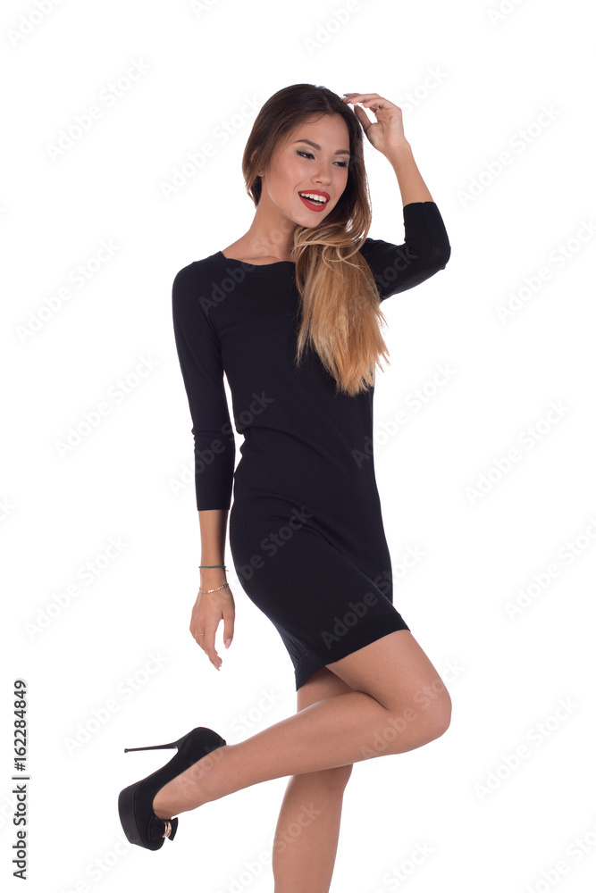 Fototapeta premium beautiful girl in a black dress on a white background
