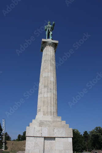 Monument sculpture of the Belgrade Victor made of bronze  located in Kalemegdan park facing the Sava River and Zemun district  Belgrade  Serbia.