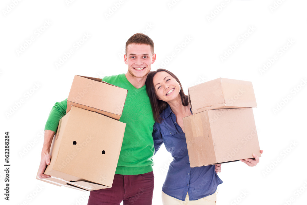 Happy smiling delivery man and woman carrying boxes isolated on white background Happy smiling delivery man and woman carrying boxes isolated on white background