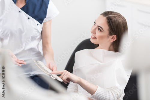 Outgoing female choosing artificial tooth