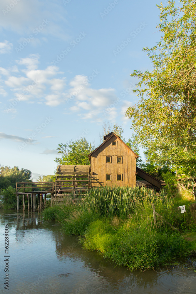wooden house near the river