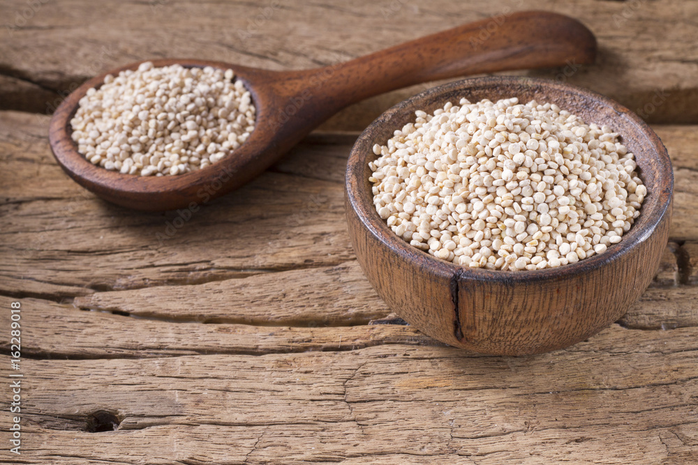 Grains of quinua on wood - Chenopodium quinoa Grains of quinua on wood - Chenopodium quinoa