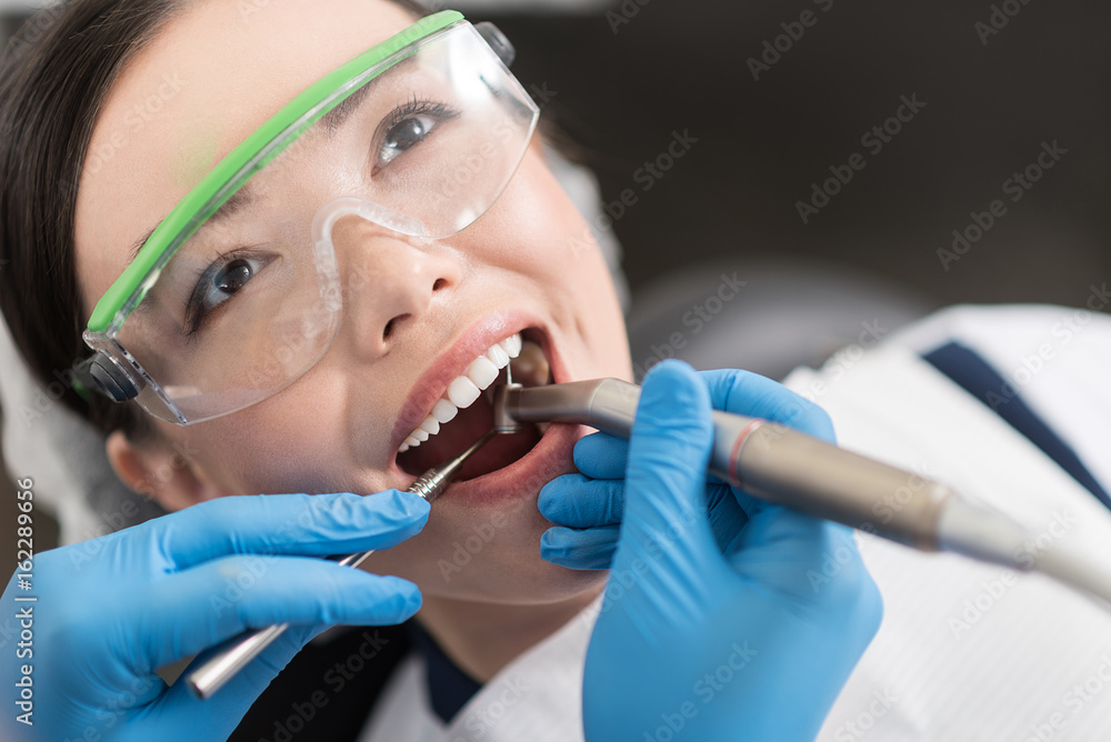 Doctor making treatment of mouth in stomatology Doctor making treatment of mouth in stomatology
