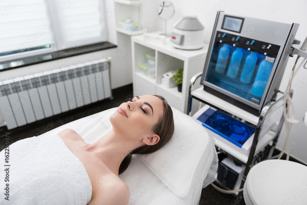 Charming young woman is resting in spa salon Charming young woman is resting in spa salon