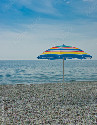 Parasol at the empty beach