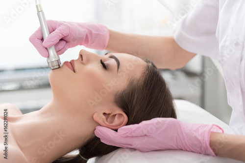 Elegant young woman is resting at beauty shop