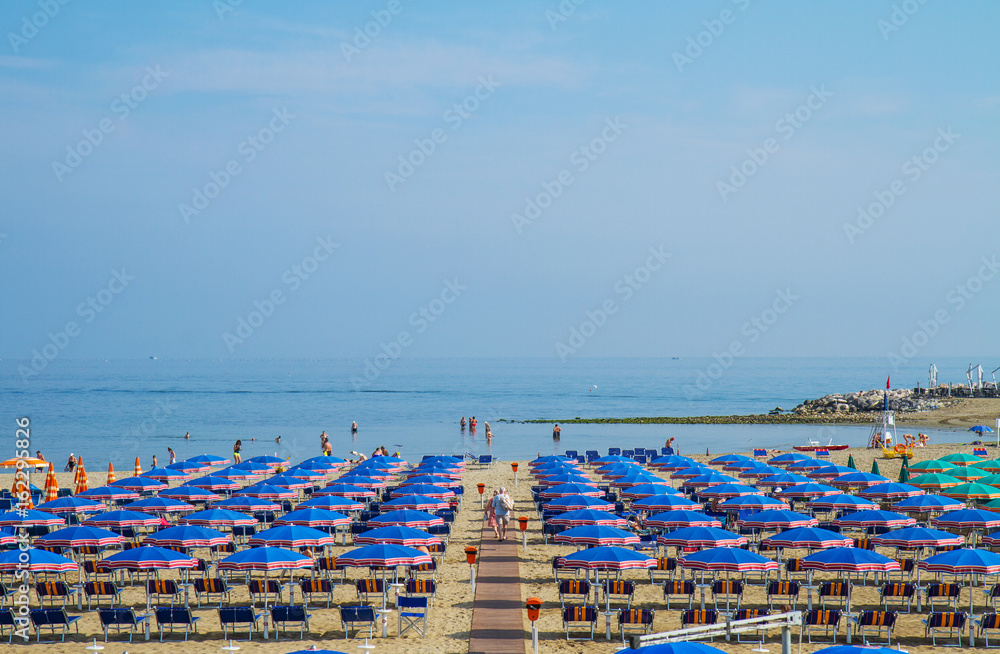  Beach on the Riviera Romagnola with umbrellas and deckchairs