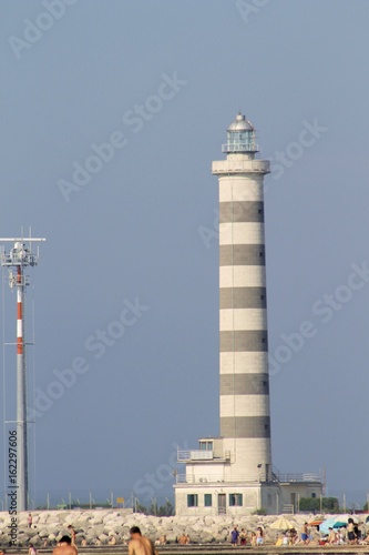 lighthouse for access to the tourist and commercial port photo