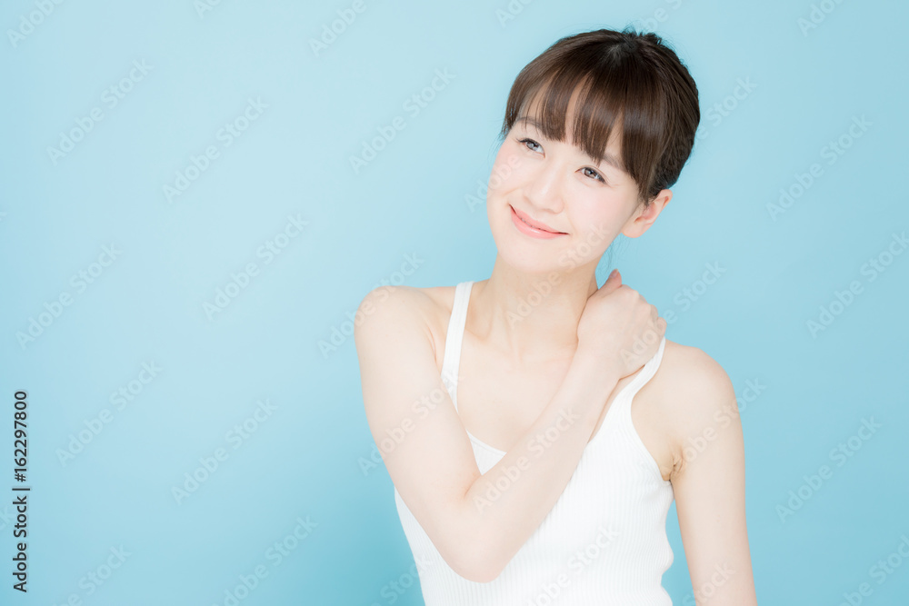 attractive asian woman beauty image on blue background attractive asian woman beauty image on blue background