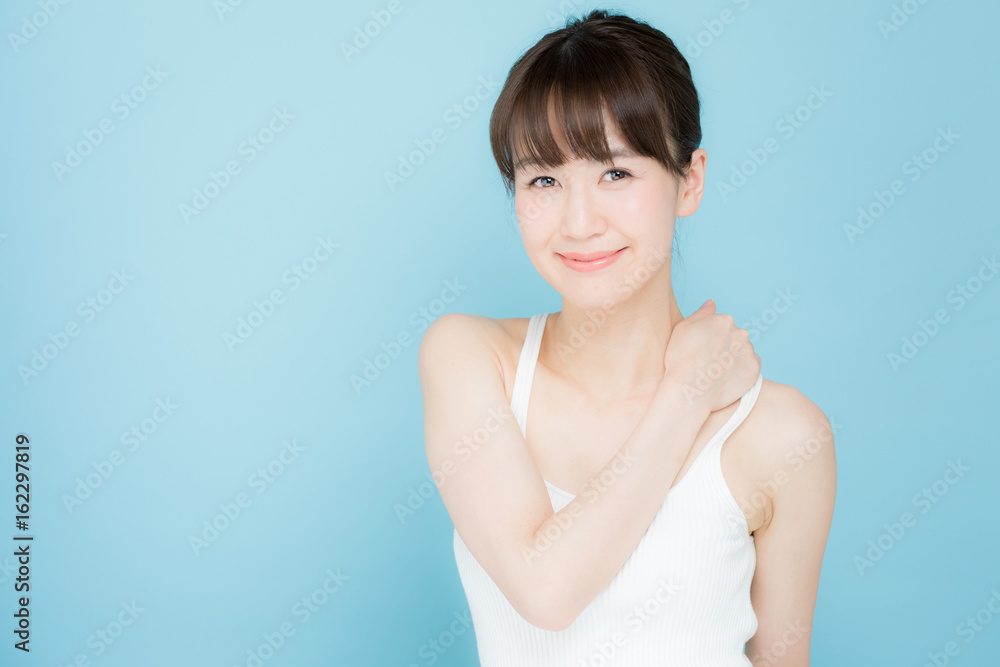 attractive asian woman beauty image on blue background attractive asian woman beauty image on blue background