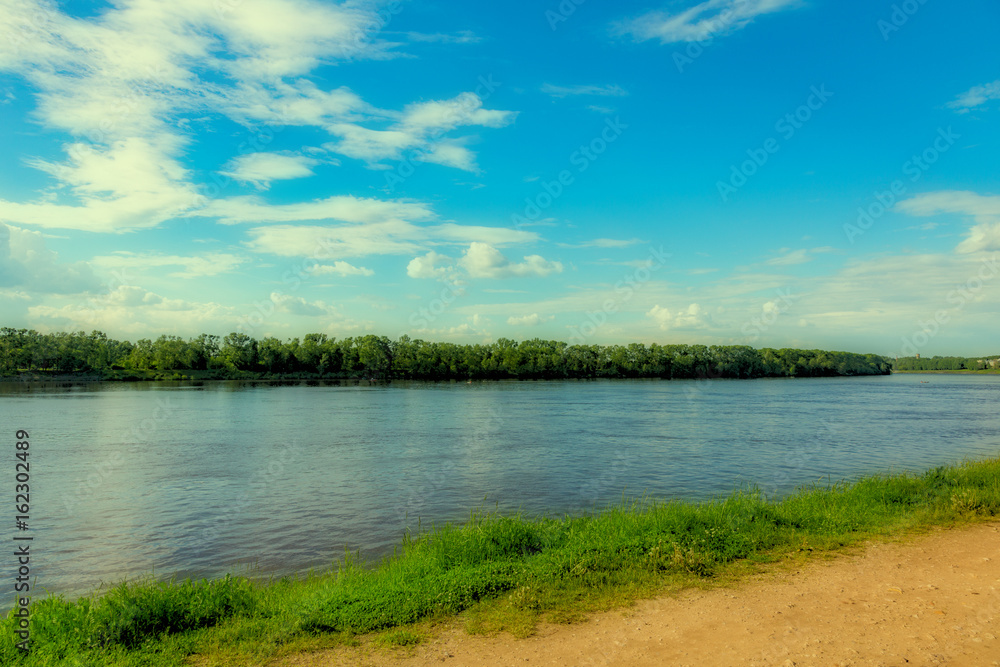 The shore of the grandiose Russian Volga river near the town of Uglich on a summer day. Yaroslavl region
