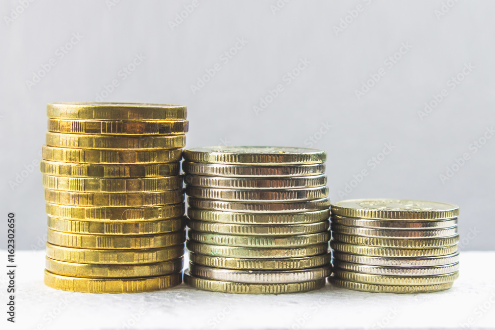 Stacks of Russian coins on a gray background with droplets of water. Stacks of Russian coins on a gray background with droplets of water.