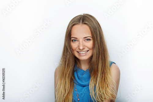 Headshot of young adorable blonde woman with cute smile on white background