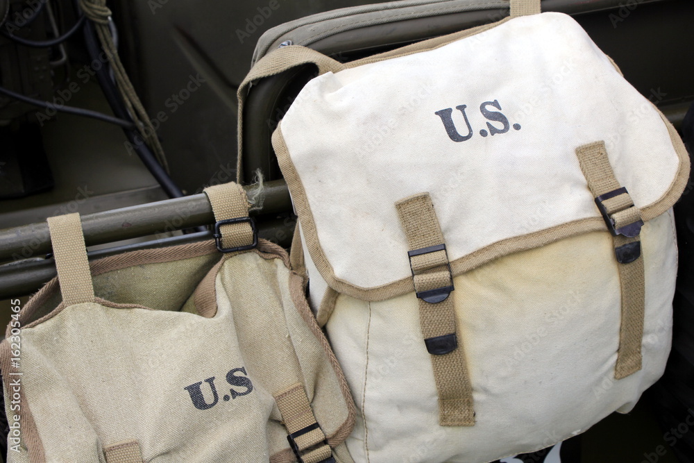 Naklejka premium Two vintage US army bags on a jeep