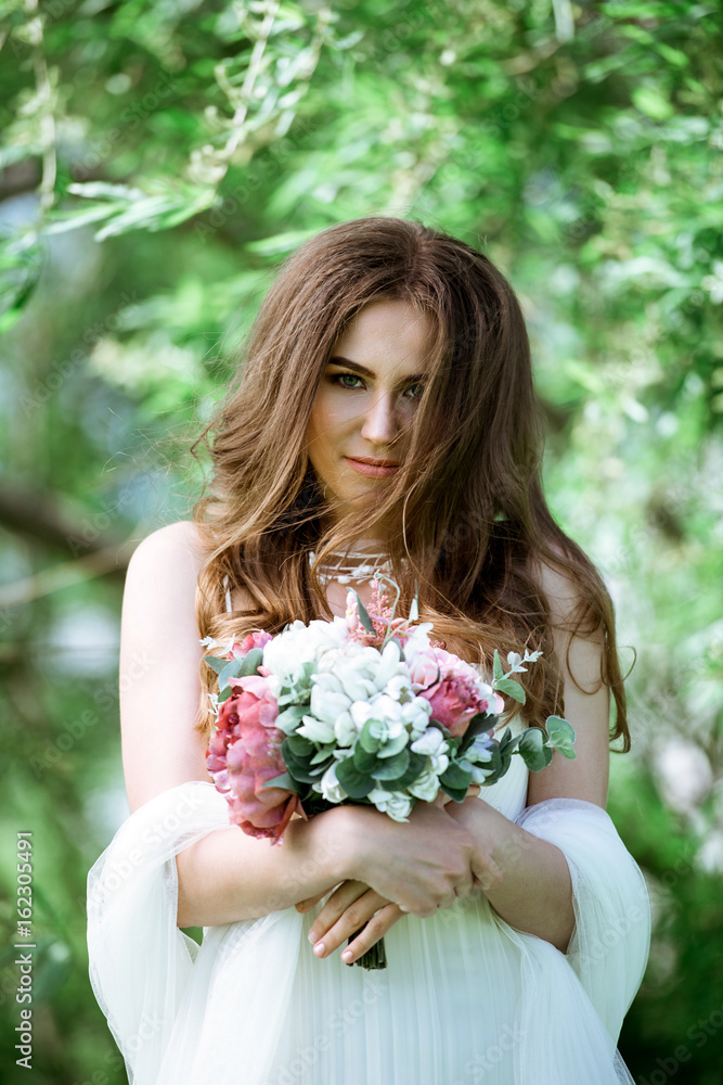 Brunette bride in fashion white wedding dress with makeup Brunette bride in fashion white wedding dress with makeup