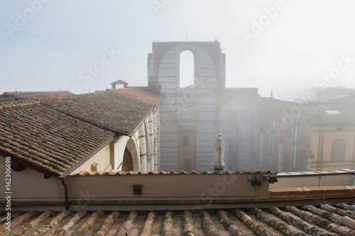 Incomplete facade of the planned Duomo nuovo or Facciatone in fog. Siena. Tuscany Italy.
