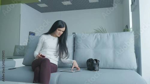 Young woman has a rest in vip lounge at the airport photo