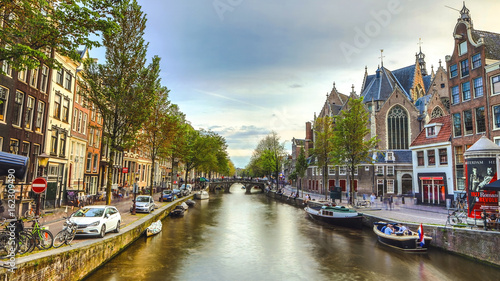 Photography AMSTERDAM, NETHERLANDS - MAY 28, 2017: General view of famous places in Amsterdam city at twilight time