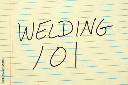 The words "Welding 101" on a yellow legal pad