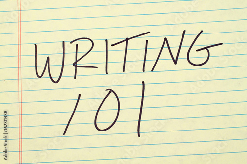 The words "Writing 101" on a yellow legal pad