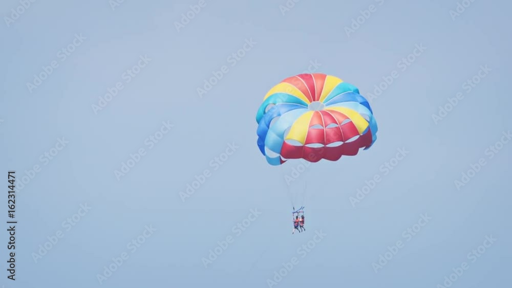 Pair of Tourists Parasailing off Maafushi Island Pair of Tourists Parasailing off Maafushi Island