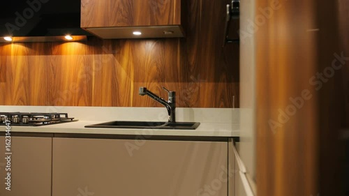 View of brown wood stylish washbasin in the kitchen in the modern style. photo