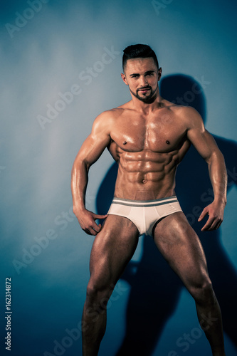 athlete with muscular body in underwear pants