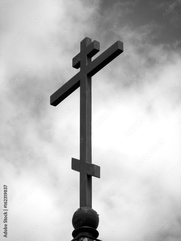 orthodox eight-pointed Russian cross/photography with scene of the orthodox cross on background sky in monochrome scene orthodox eight-pointed Russian cross/photography with scene of the orthodox cross on background sky in monochrome scene