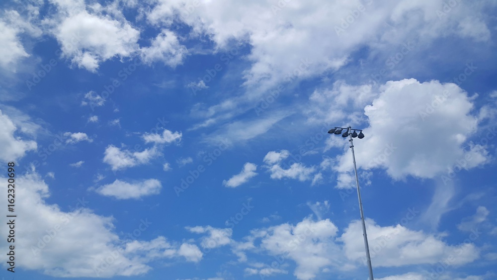 Beautiful blue sky with small spotlight stand alone on right side. Beautiful blue sky with small spotlight stand alone on right side.