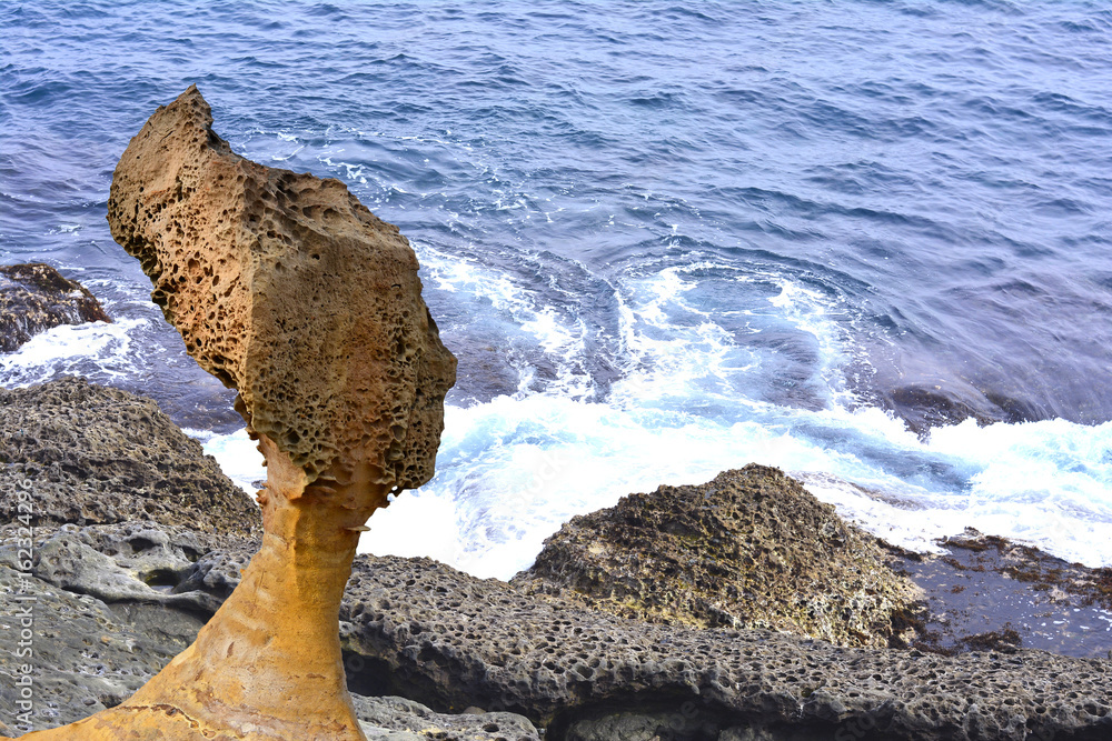 Queen Rock in Yehliu Geopark, Taiwan on the sea and stone background Queen Rock in Yehliu Geopark, Taiwan on the sea and stone background