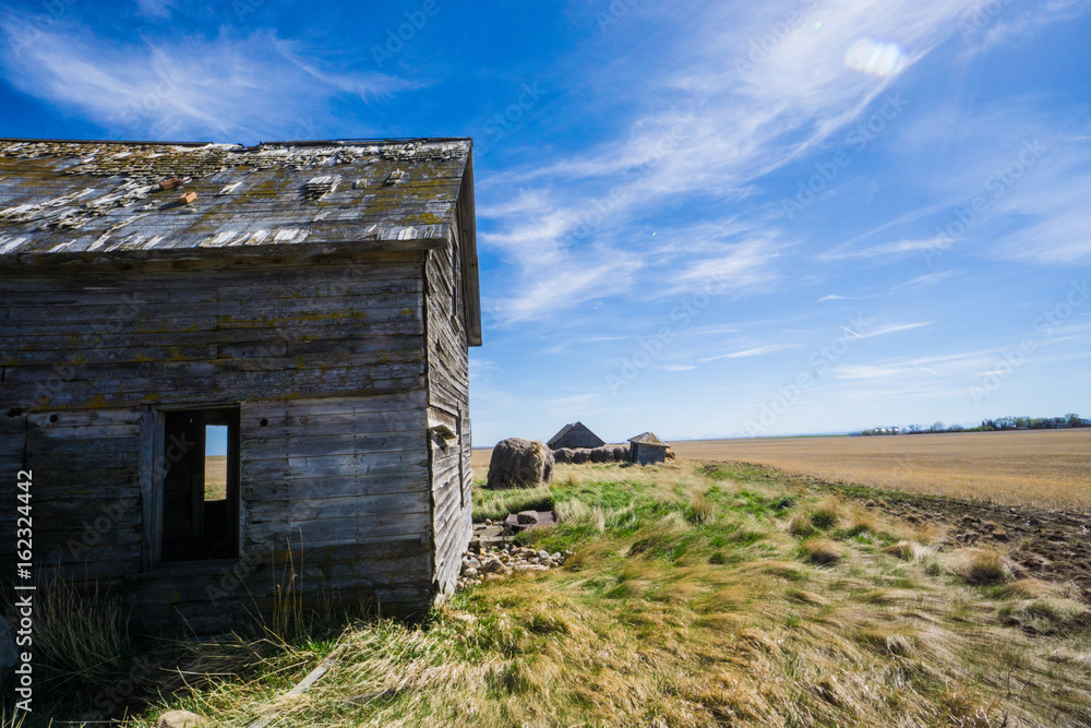 abandoned farmhouse in a field abandoned farmhouse in a field