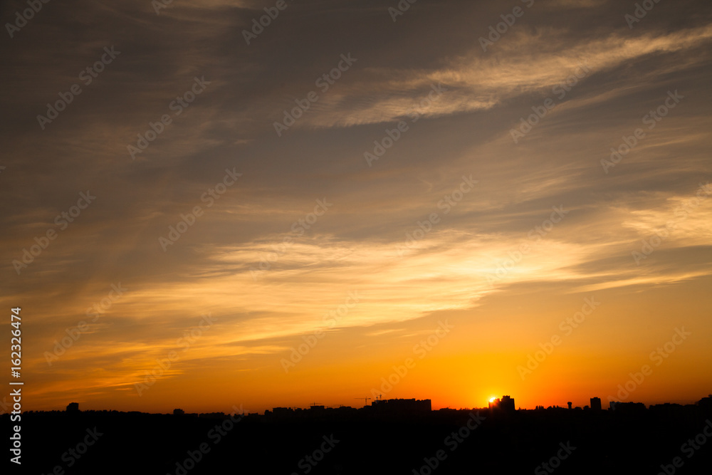 Sunset in the city beyond the horizon from the height Sunset in the city beyond the horizon from the height