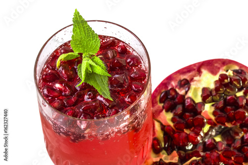 Enriched with useful delicious pomegranate juice in a glass