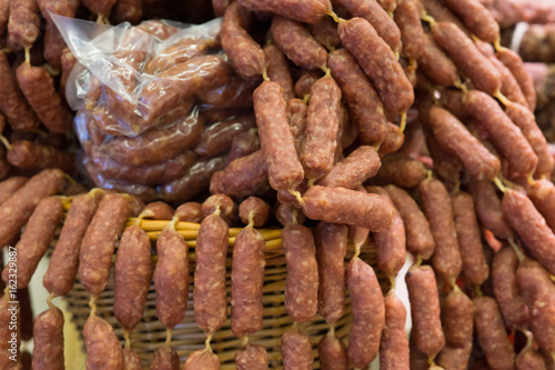 Food plat with delicious salami, pieces of sliced ham, sausage, cooked in a traditional way.