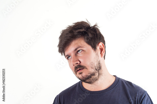 Portrait of 30 years old man with boring and misunderstanding face and Disheveled hair style
