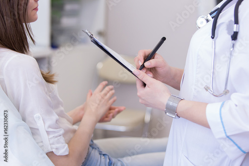 Female doctor explaining diagnosis to her female patient