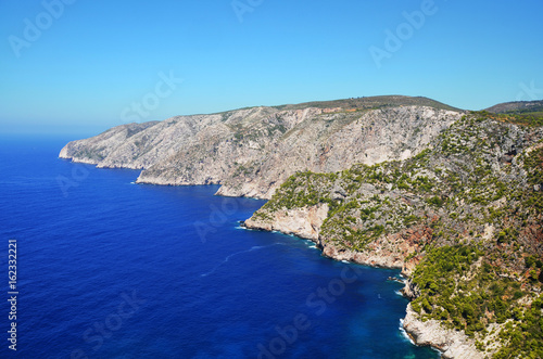 rocky shore and blue sea to the horizon