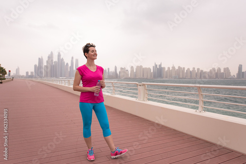 young woman celebrating a successful training run