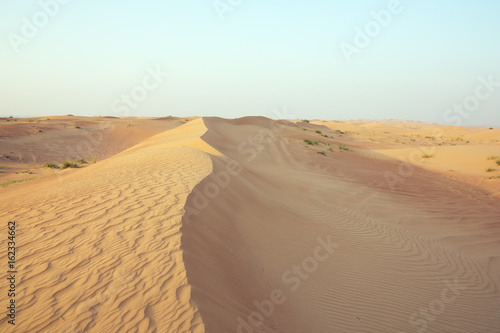 Sand dune ridge with wind marks in the Dubai desert